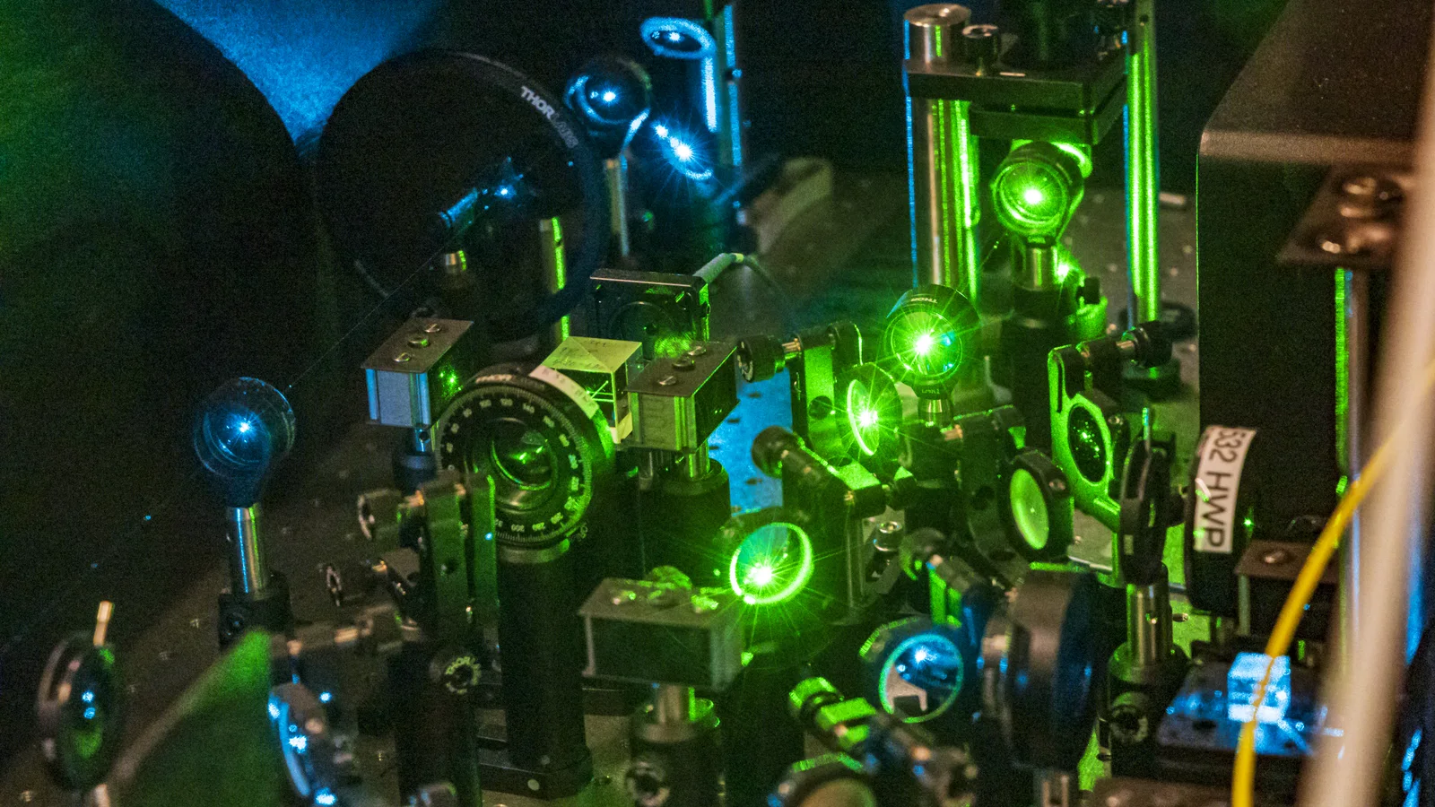 Quantum laboratory equipment surrounding a dilution refrigerator used for spin measurements.