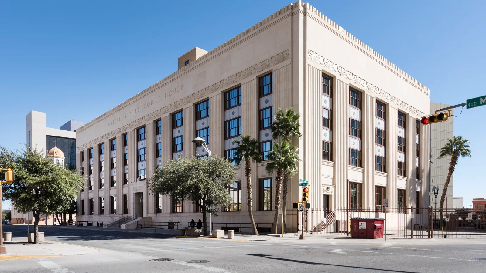Exterior of the federal courthouse in El Paso at dusk.
