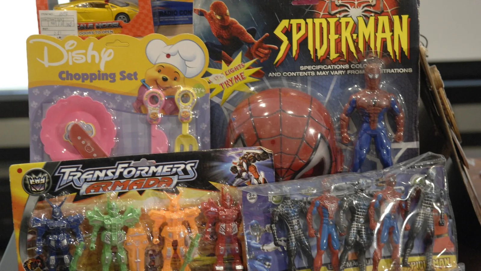 Boxes and loose counterfeit toys displayed after a federal seizure.